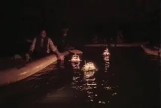 Floating krathong at night