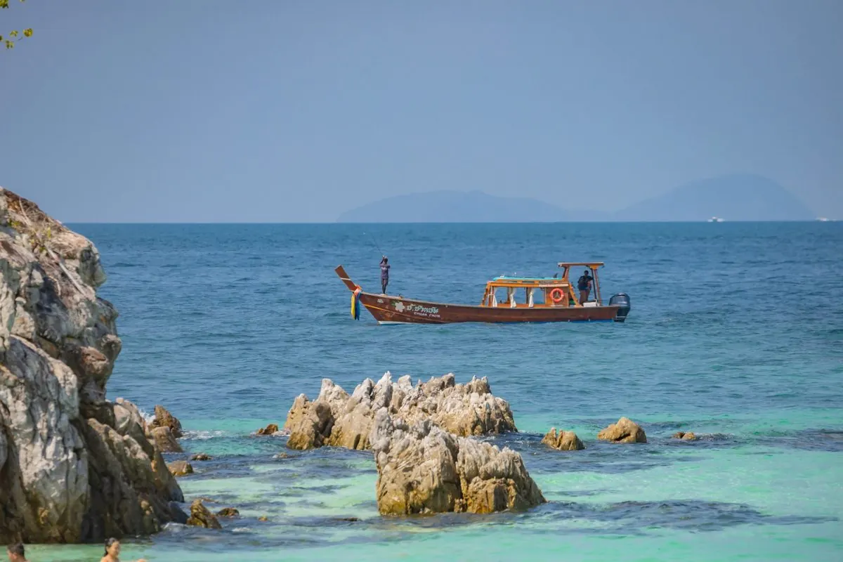 Longtail boat by the rocks, Khai Island