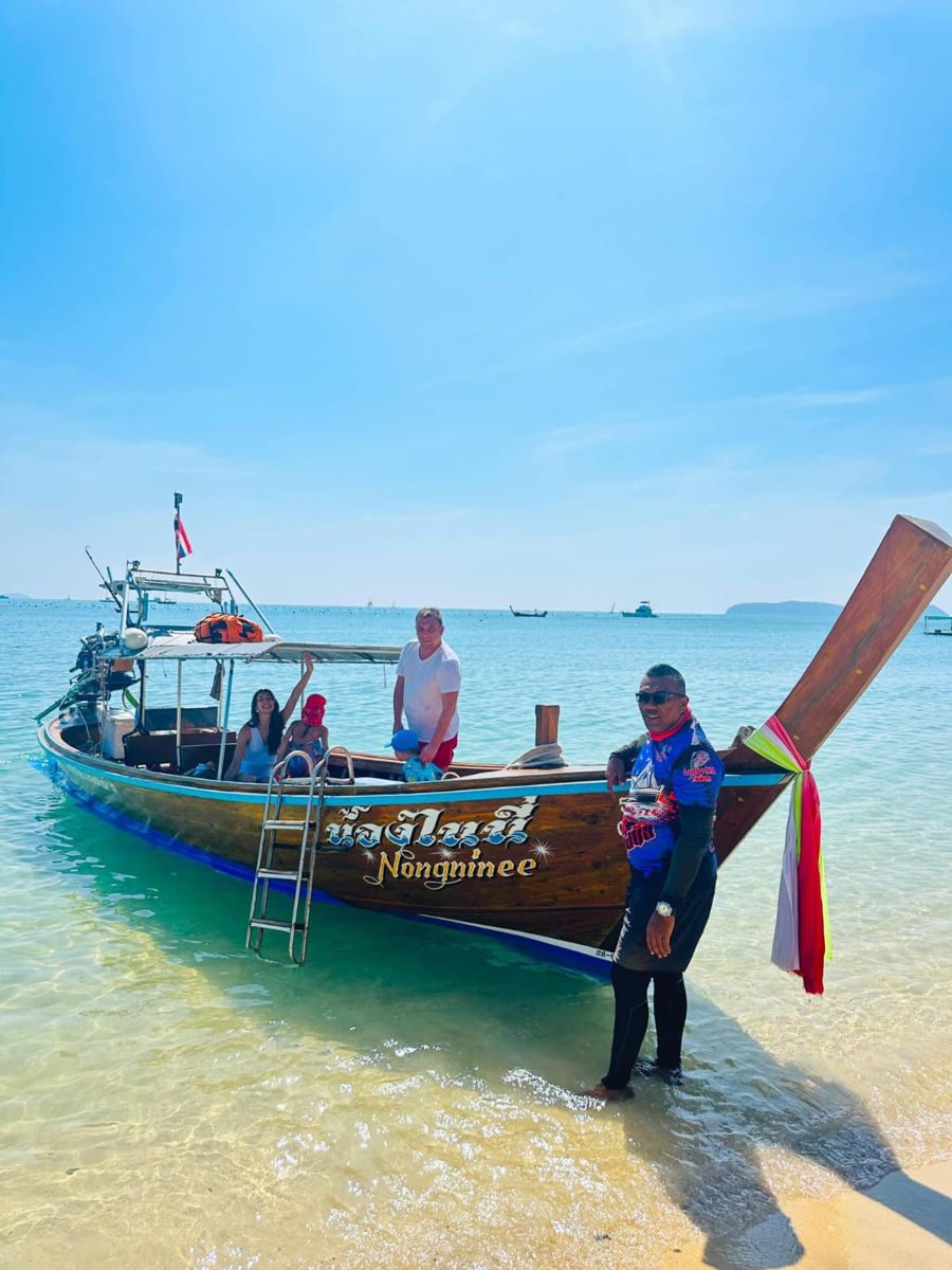 Private long-tail boat on the beach