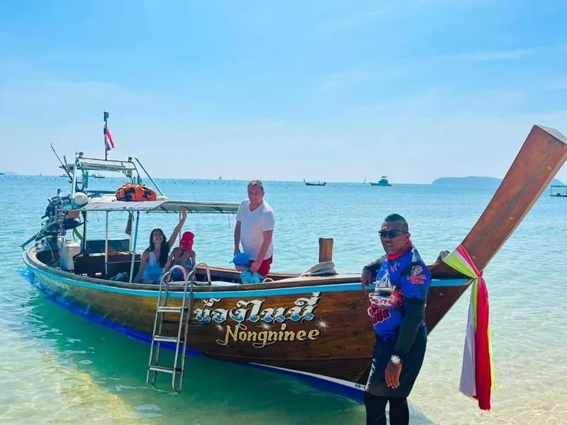 Private long-tail boat on the beach